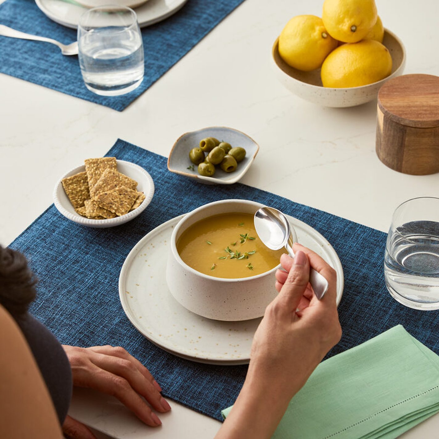 A bowl of Prolon plant-based soup with a spoon